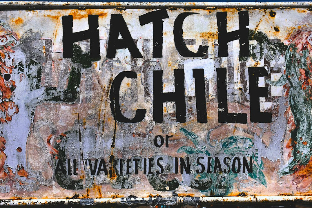 Framed illustrated map poster of Chile hanging on a wall