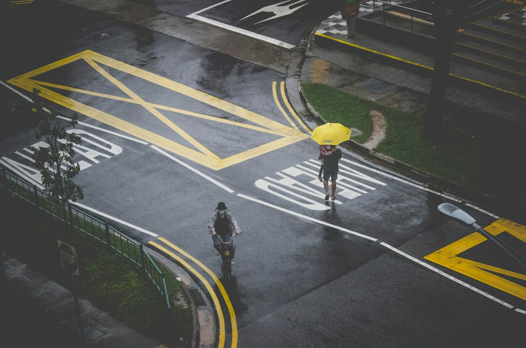 detective walking in rain